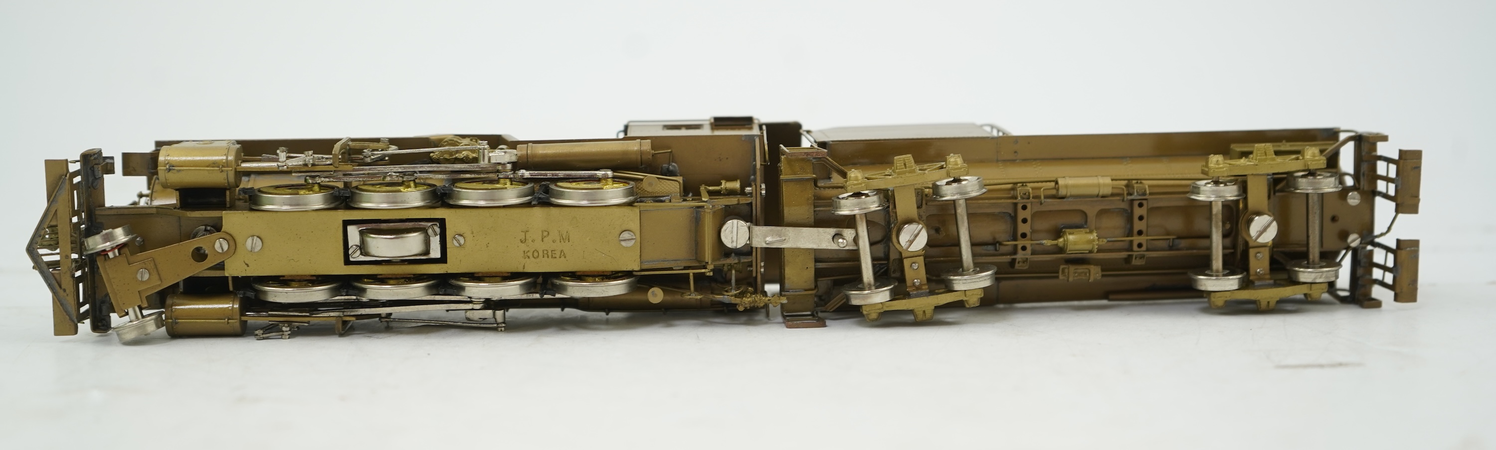 A boxed HO gauge Overland Models Inc. J.P.M. unpainted brass model of Union Pacific Railway C-57, 2-8-0 locomotive with bogie tender, powered for two rail operation.